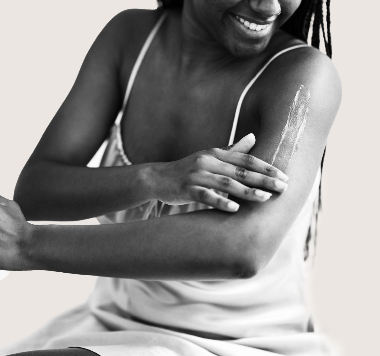 Woman applying gel to arm